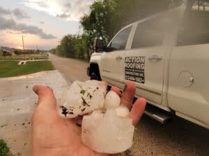 large hail from bell county next to action roofing truck