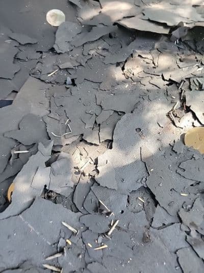 debris from a teardown during a storm restoration roofing project