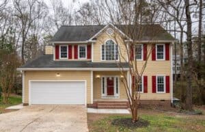 a suburban home with roofing restored after a storm